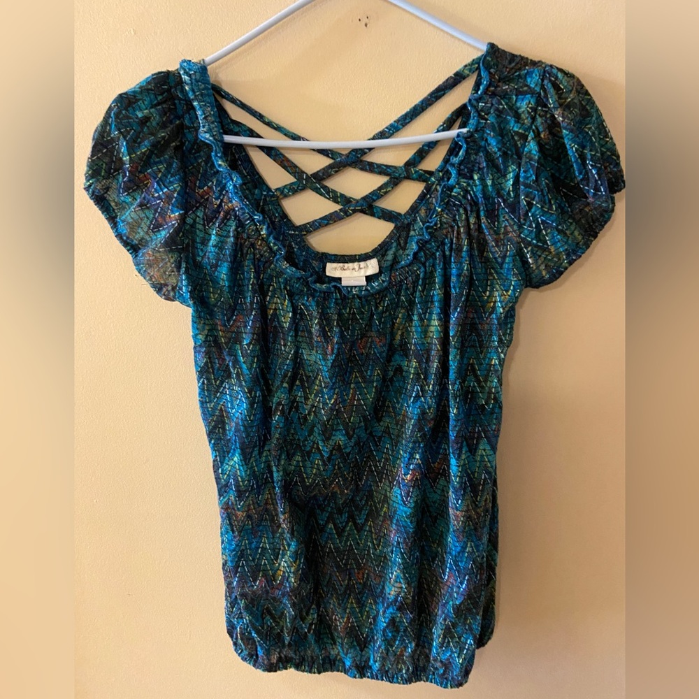 Blue-green top with ruffled front and accent straps size medium